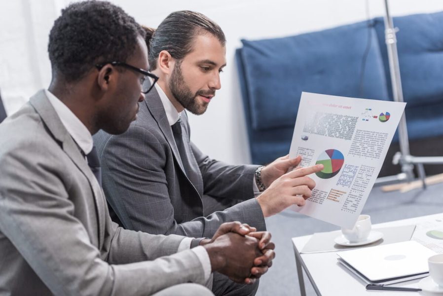 multiethnic-business-partners-looking-at-document-2024-11-18-03-51-08-utc.jpg